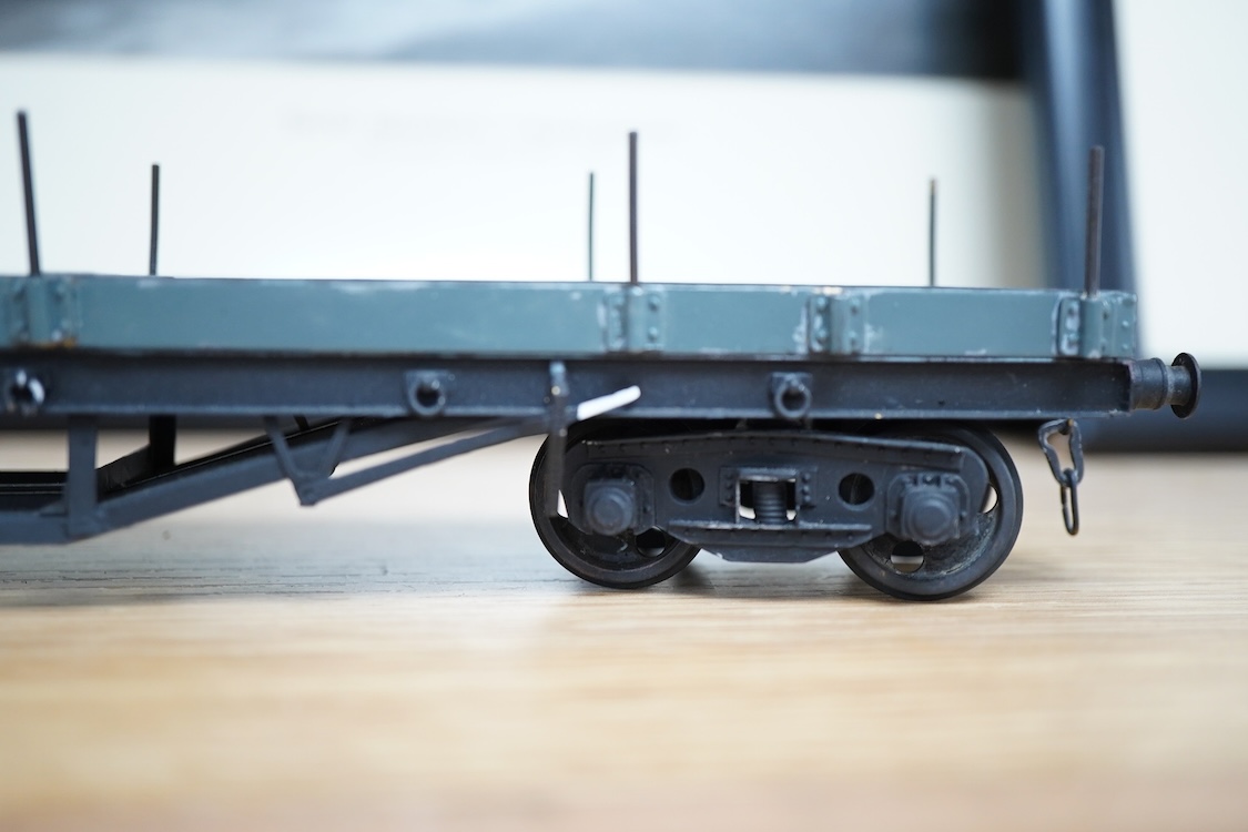 Eleven 0 gauge model railway items including; a bogie stake wagon, two mineral wagons, a North British coal wagon and two further open wagons, a partly constructed brake van, together with a Lima LMS 4F locomotive, two L